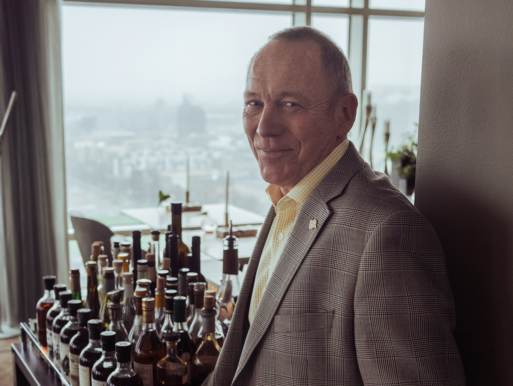 Swedish whisky enthusiast Pye Palm at Upper House with parts of his “full deck” of unopened Ichiro’s Malt Card collection from the Hanyu distillery in Japan.