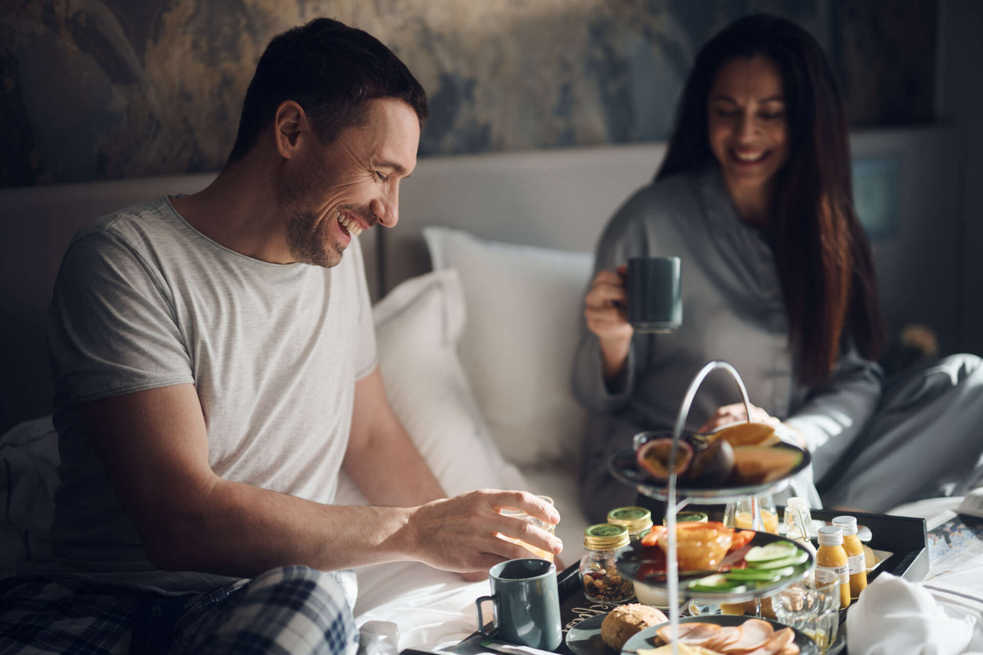 Couple, par food on room