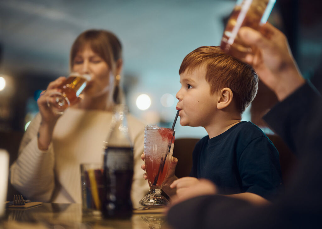 Kids with family having dinner at Coner.