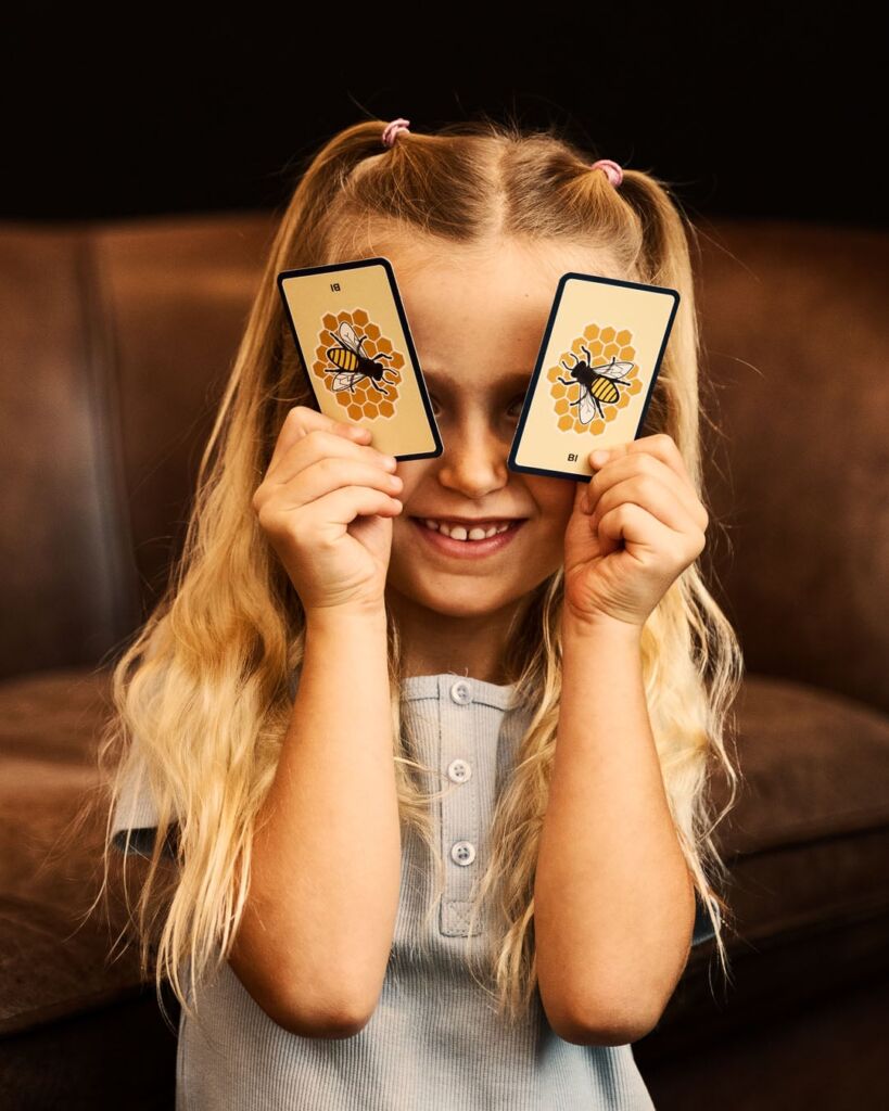 Kids at corner playing with cards