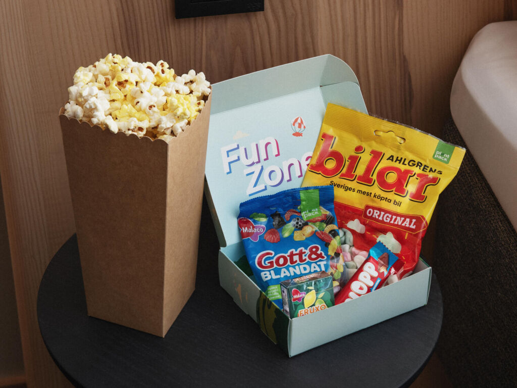Funbox with popcorn and snacks in a colorful package.